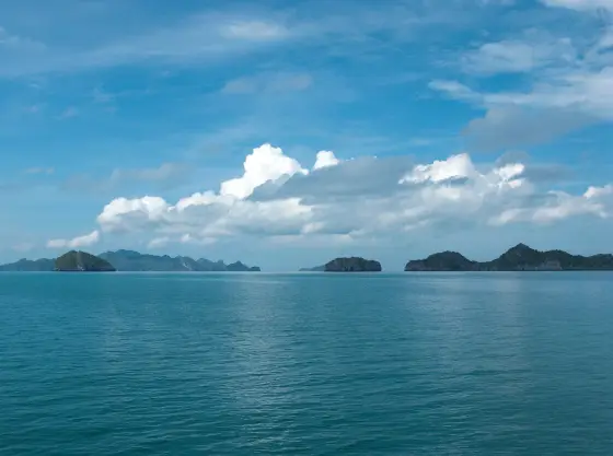 Ang Thong islands on the horizon above a calm sea