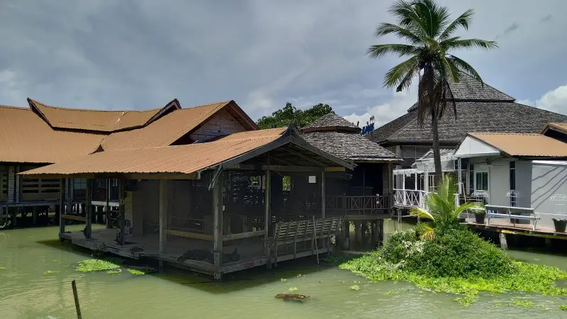 Wooden pavilions on stilts over the water inside the market
