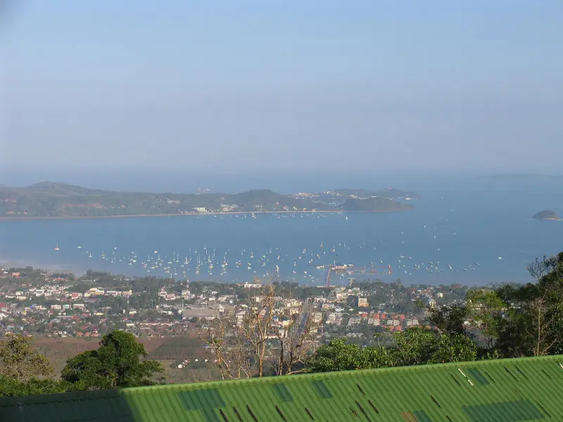 Chalong Bay from above with yachts at anchor, the pier and islands on the horizon, where boats to Maiton set out