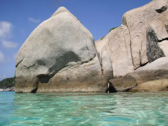 Granite boulders of Nang Yuan above clear turquoise water