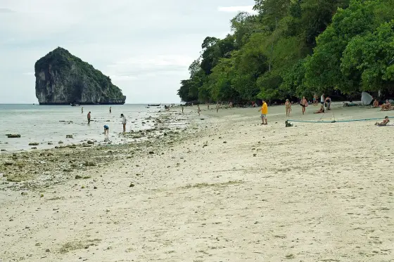 A beach with a view of rocky Chicken Island (Ko Kai)