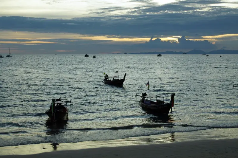 Longtail boats off Ao Nang Beach in the evening