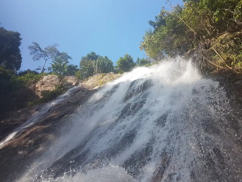 The Na Muang waterfall pouring down, shot from below