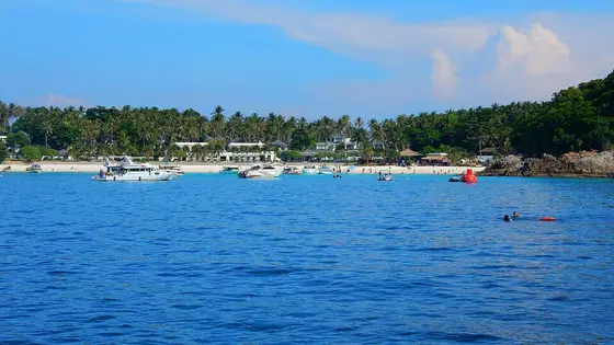 Boats anchored off the Racha Yai beach, seen from the sea